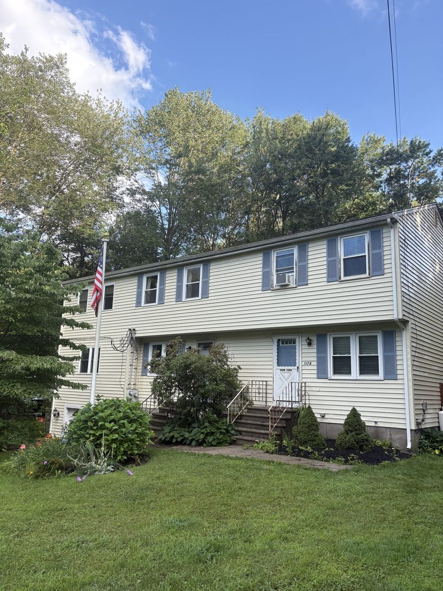 Same house siding clean after power washing